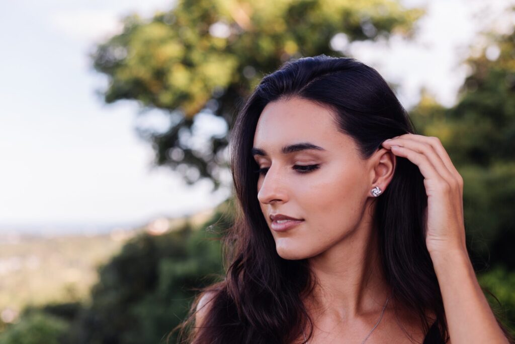 portrait of caucasian woman wearing celtic knot earings